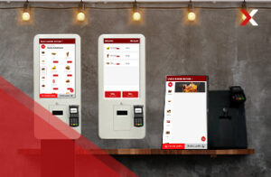 A imagem destaca três totens de autoatendimento diferentes, um do tipo pedestal, outro de parede e um totem de bancada. Todos da empresa NEXTCARD